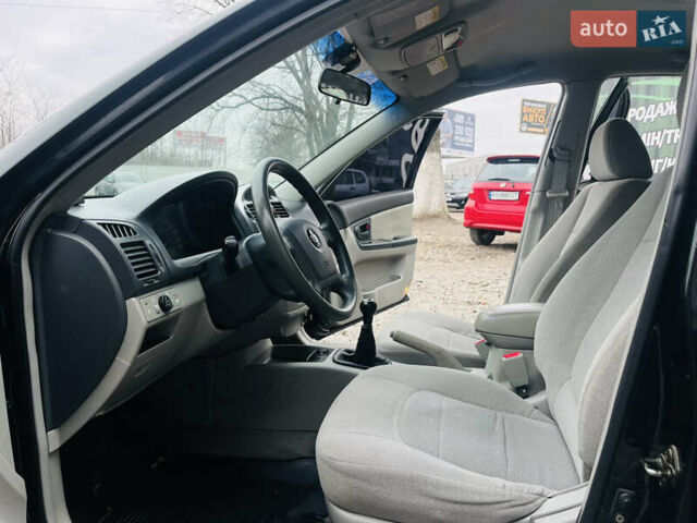 Чорний Кіа Черато, об'ємом двигуна 2 л та пробігом 319 тис. км за 4300 $, фото 8 на Automoto.ua