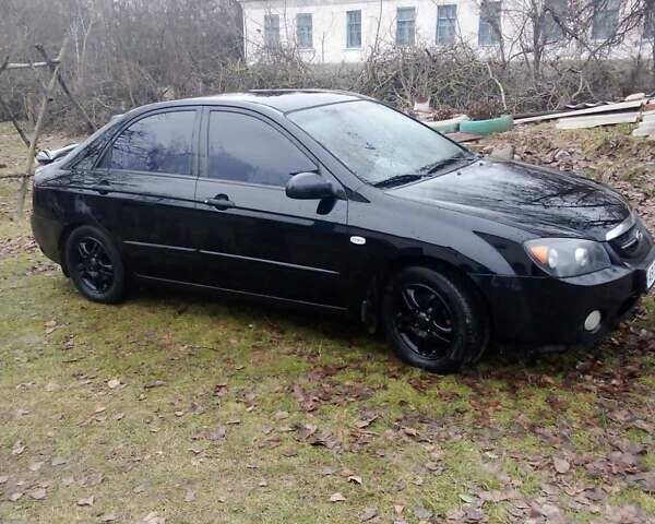 Черный Киа Черато, объемом двигателя 2 л и пробегом 240 тыс. км за 4200 $, фото 4 на Automoto.ua