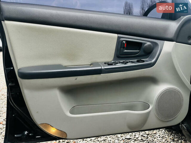 Чорний Кіа Черато, об'ємом двигуна 2 л та пробігом 319 тис. км за 4300 $, фото 10 на Automoto.ua