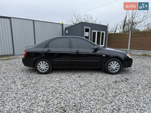 Черный Киа Черато, объемом двигателя 1.6 л и пробегом 220 тыс. км за 3300 $, фото 5 на Automoto.ua