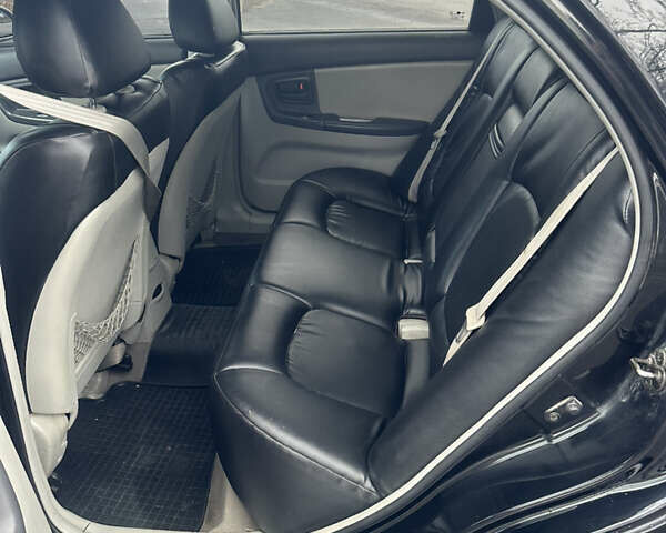 Черный Киа Черато, объемом двигателя 1.98 л и пробегом 236 тыс. км за 4100 $, фото 8 на Automoto.ua