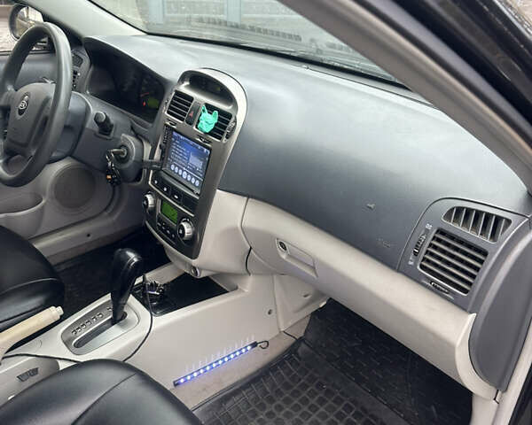 Черный Киа Черато, объемом двигателя 1.98 л и пробегом 236 тыс. км за 4100 $, фото 17 на Automoto.ua