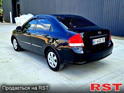 Черный Киа Черато, объемом двигателя 1.6 л и пробегом 300 тыс. км за 4000 $, фото 2 на Automoto.ua