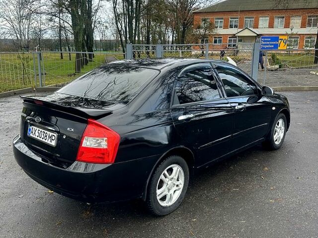 Черный Киа Черато, объемом двигателя 2 л и пробегом 232 тыс. км за 4100 $, фото 3 на Automoto.ua