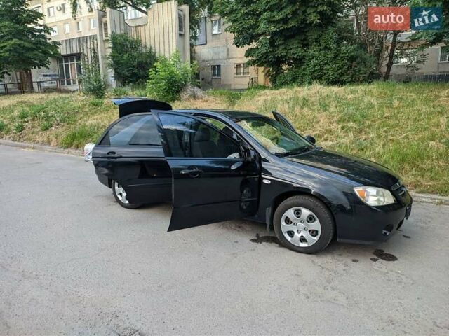 Чорний Кіа Черато, об'ємом двигуна 1.5 л та пробігом 221 тис. км за 4200 $, фото 4 на Automoto.ua