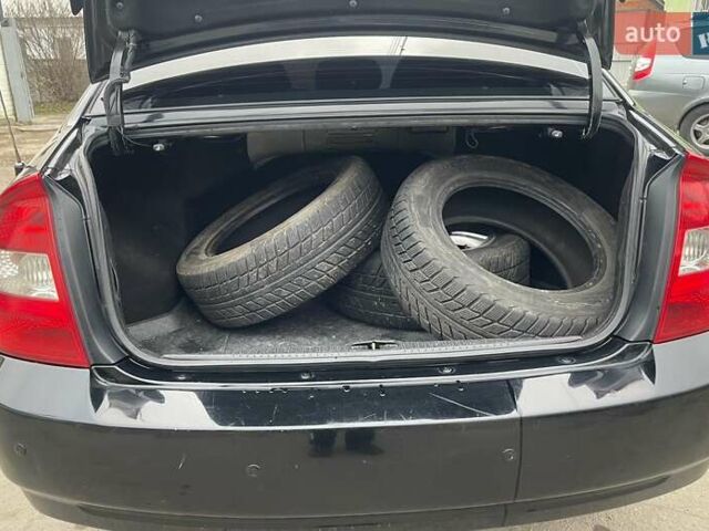 Черный Киа Черато, объемом двигателя 2 л и пробегом 318 тыс. км за 3900 $, фото 7 на Automoto.ua