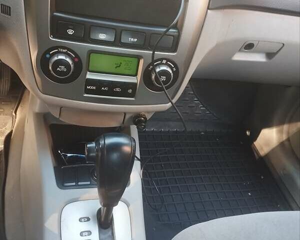 Черный Киа Черато, объемом двигателя 2 л и пробегом 220 тыс. км за 4900 $, фото 1 на Automoto.ua