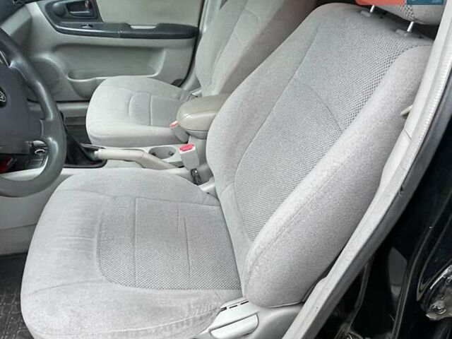 Черный Киа Черато, объемом двигателя 2 л и пробегом 318 тыс. км за 3900 $, фото 12 на Automoto.ua