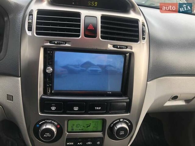 Чорний Кіа Черато, об'ємом двигуна 2 л та пробігом 177 тис. км за 4399 $, фото 29 на Automoto.ua