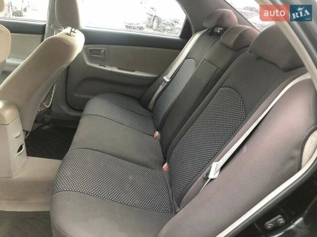 Чорний Кіа Черато, об'ємом двигуна 2 л та пробігом 177 тис. км за 4399 $, фото 16 на Automoto.ua