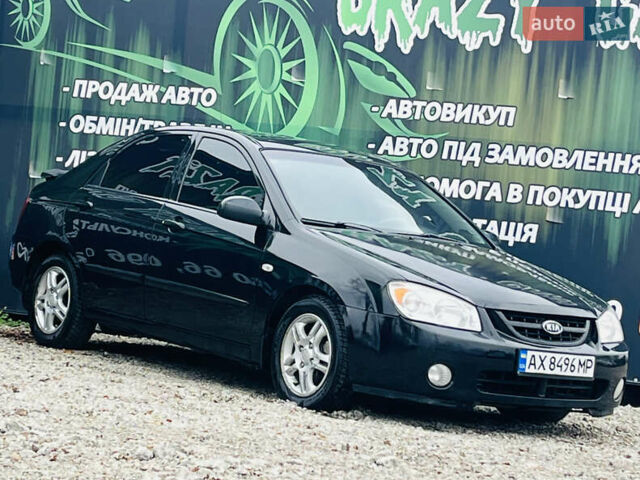 Чорний Кіа Черато, об'ємом двигуна 2 л та пробігом 319 тис. км за 4300 $, фото 4 на Automoto.ua
