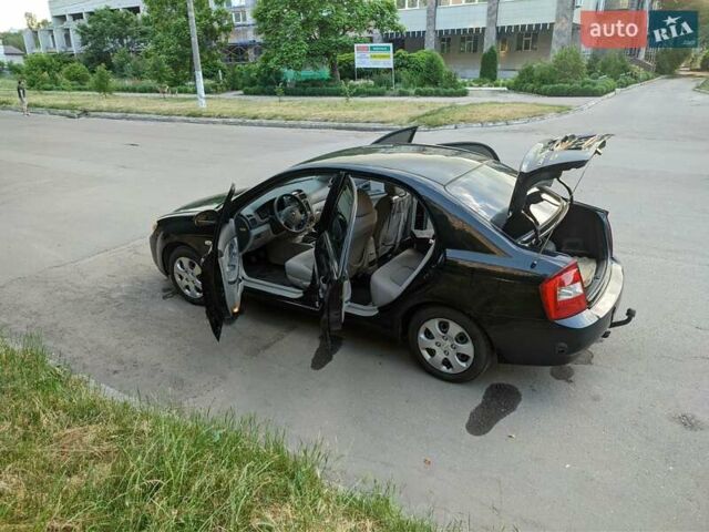 Чорний Кіа Черато, об'ємом двигуна 1.5 л та пробігом 221 тис. км за 4200 $, фото 5 на Automoto.ua