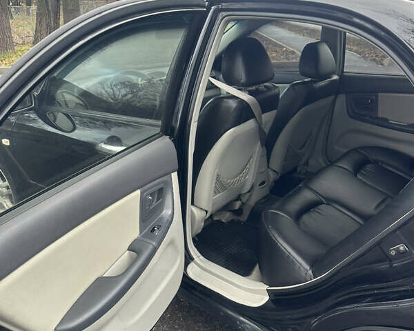 Черный Киа Черато, объемом двигателя 1.98 л и пробегом 236 тыс. км за 4100 $, фото 9 на Automoto.ua