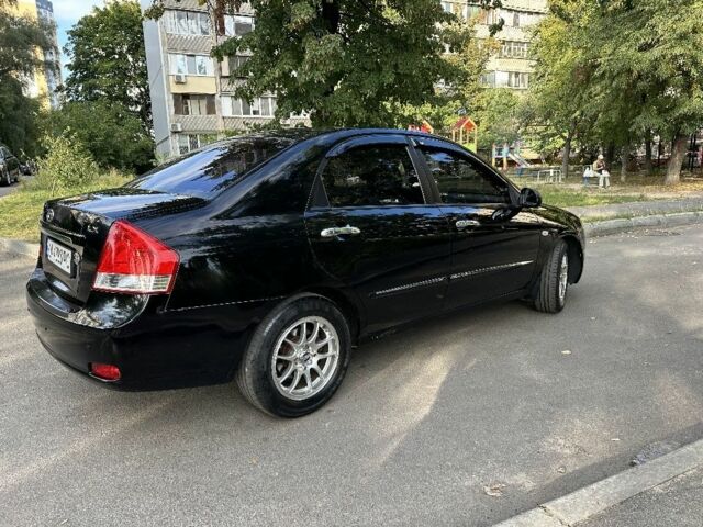 Черный Киа Черато, объемом двигателя 1.6 л и пробегом 181 тыс. км за 3900 $, фото 1 на Automoto.ua