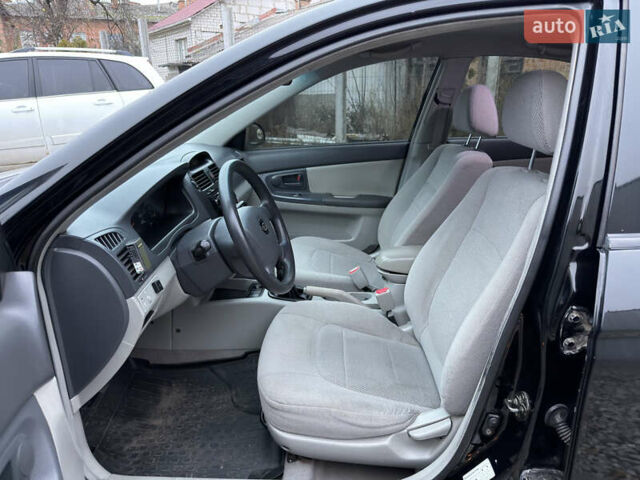 Черный Киа Черато, объемом двигателя 1.6 л и пробегом 220 тыс. км за 3300 $, фото 13 на Automoto.ua