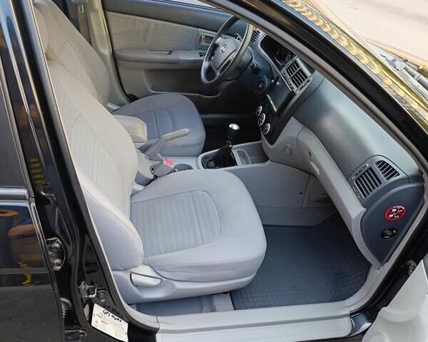 Чорний Кіа Черато, об'ємом двигуна 1.6 л та пробігом 237 тис. км за 5300 $, фото 17 на Automoto.ua