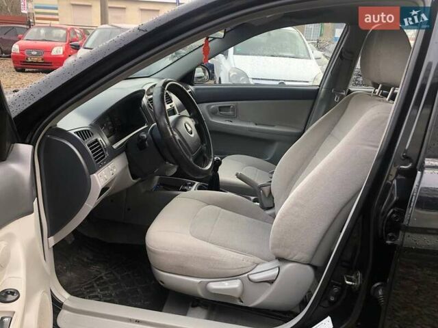 Чорний Кіа Черато, об'ємом двигуна 2 л та пробігом 177 тис. км за 4399 $, фото 13 на Automoto.ua