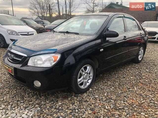 Чорний Кіа Черато, об'ємом двигуна 2 л та пробігом 177 тис. км за 4399 $, фото 2 на Automoto.ua