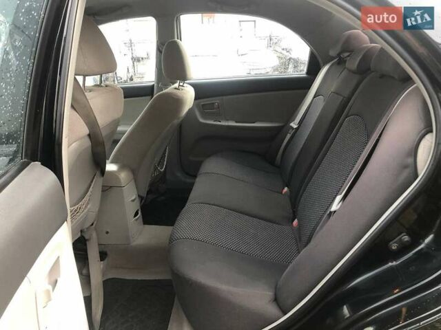 Чорний Кіа Черато, об'ємом двигуна 2 л та пробігом 177 тис. км за 4399 $, фото 15 на Automoto.ua