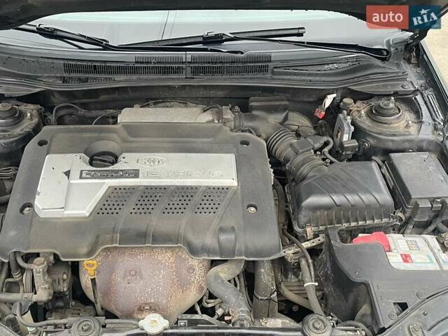 Черный Киа Черато, объемом двигателя 2 л и пробегом 318 тыс. км за 3900 $, фото 8 на Automoto.ua