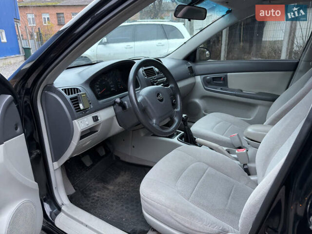 Черный Киа Черато, объемом двигателя 1.6 л и пробегом 220 тыс. км за 3300 $, фото 12 на Automoto.ua