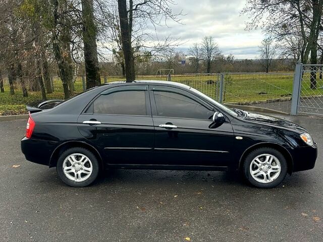 Черный Киа Черато, объемом двигателя 2 л и пробегом 232 тыс. км за 4100 $, фото 4 на Automoto.ua