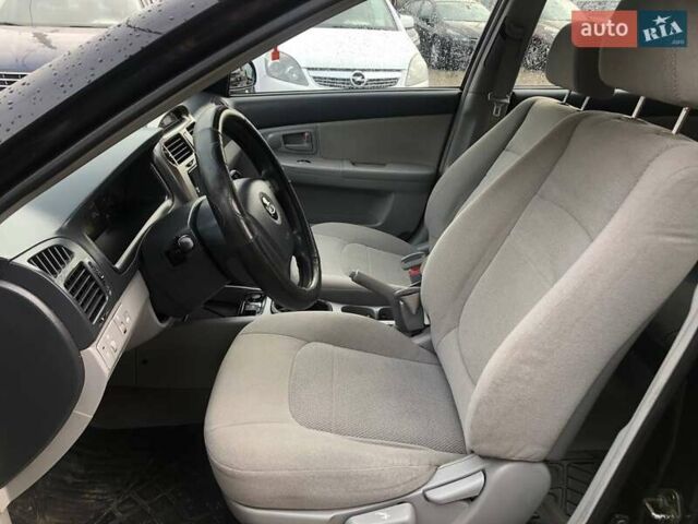 Чорний Кіа Черато, об'ємом двигуна 2 л та пробігом 177 тис. км за 4399 $, фото 12 на Automoto.ua