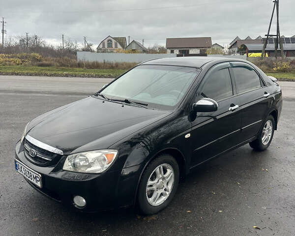 Черный Киа Черато, объемом двигателя 1.98 л и пробегом 236 тыс. км за 4100 $, фото 1 на Automoto.ua