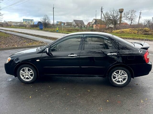 Черный Киа Черато, объемом двигателя 2 л и пробегом 232 тыс. км за 4100 $, фото 5 на Automoto.ua