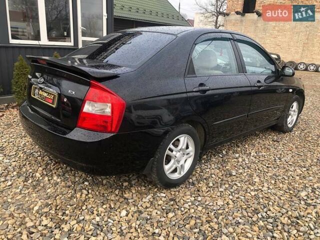 Чорний Кіа Черато, об'ємом двигуна 2 л та пробігом 177 тис. км за 4399 $, фото 7 на Automoto.ua