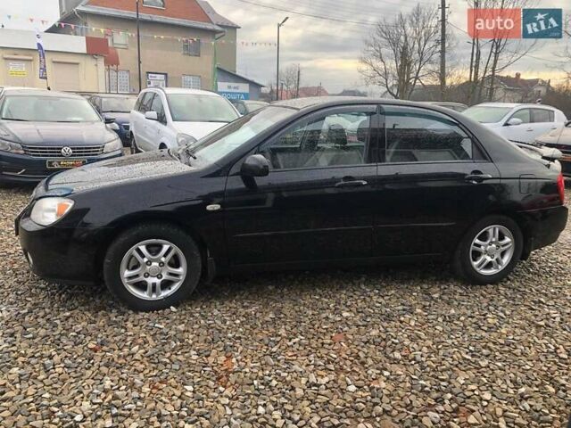 Чорний Кіа Черато, об'ємом двигуна 2 л та пробігом 177 тис. км за 4399 $, фото 3 на Automoto.ua