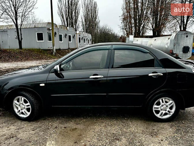 Чорний Кіа Черато, об'ємом двигуна 1.98 л та пробігом 240 тис. км за 5100 $, фото 6 на Automoto.ua