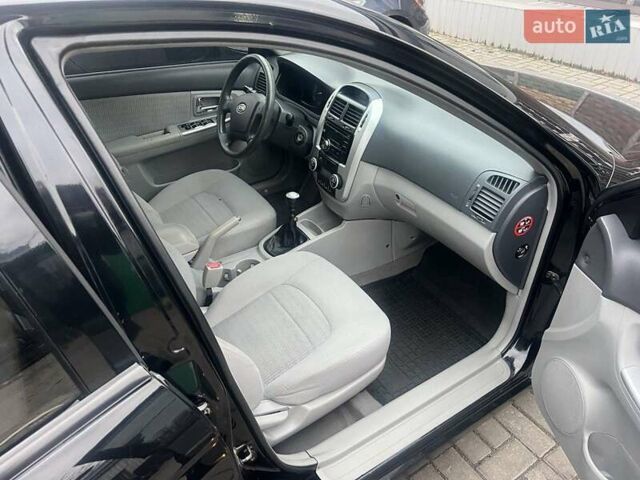 Черный Киа Черато, объемом двигателя 1.6 л и пробегом 180 тыс. км за 4900 $, фото 8 на Automoto.ua