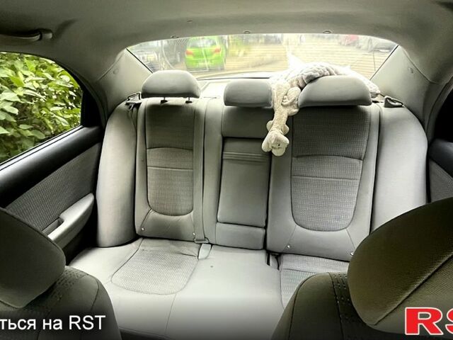 Черный Киа Черато, объемом двигателя 2 л и пробегом 163 тыс. км за 3000 $, фото 7 на Automoto.ua