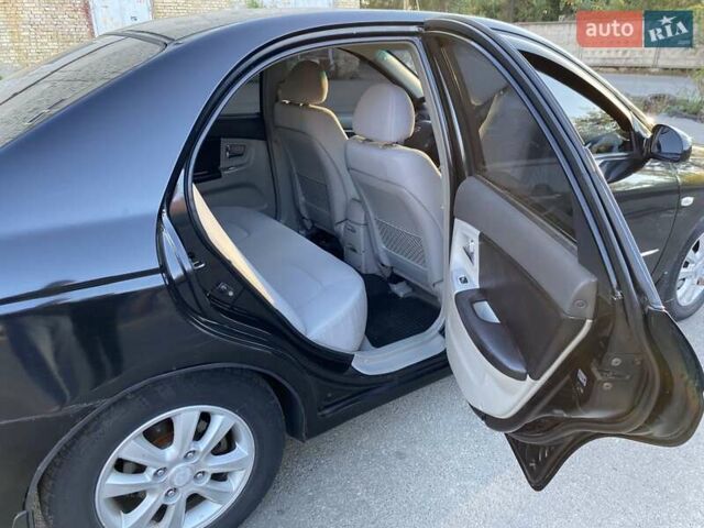 Черный Киа Черато, объемом двигателя 1.98 л и пробегом 335 тыс. км за 4100 $, фото 13 на Automoto.ua