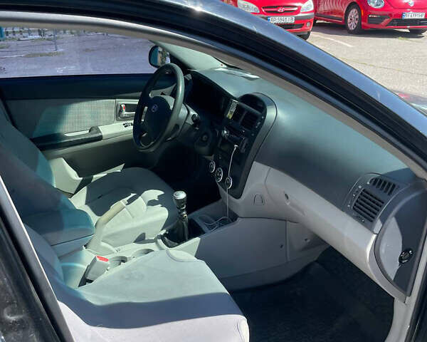 Черный Киа Черато, объемом двигателя 1.59 л и пробегом 210 тыс. км за 4100 $, фото 8 на Automoto.ua