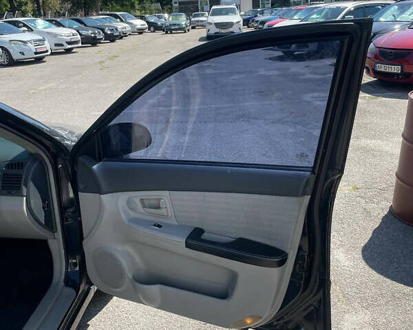 Черный Киа Черато, объемом двигателя 1.59 л и пробегом 210 тыс. км за 4100 $, фото 12 на Automoto.ua