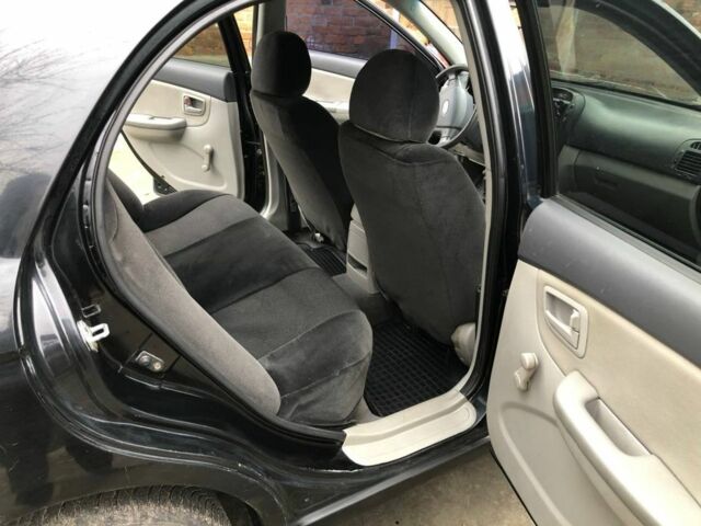 Черный Киа Черато, объемом двигателя 1.6 л и пробегом 240 тыс. км за 3300 $, фото 11 на Automoto.ua