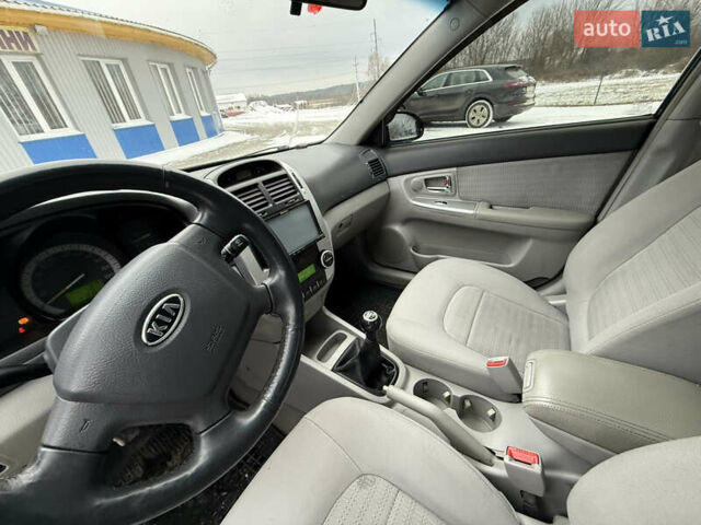 Чорний Кіа Черато, об'ємом двигуна 2 л та пробігом 258 тис. км за 2900 $, фото 14 на Automoto.ua