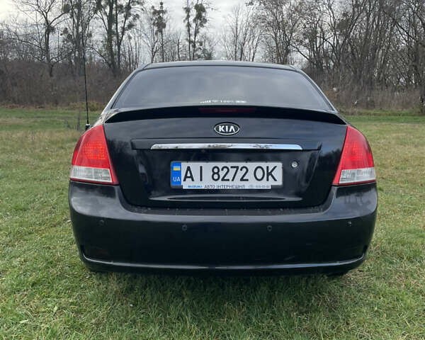 Черный Киа Черато, объемом двигателя 1.98 л и пробегом 315 тыс. км за 5745 $, фото 7 на Automoto.ua