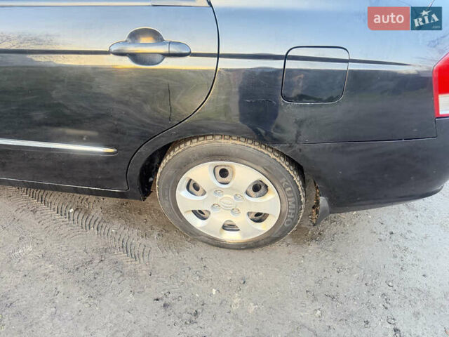 Чорний Кіа Черато, об'ємом двигуна 1.59 л та пробігом 250 тис. км за 4300 $, фото 19 на Automoto.ua