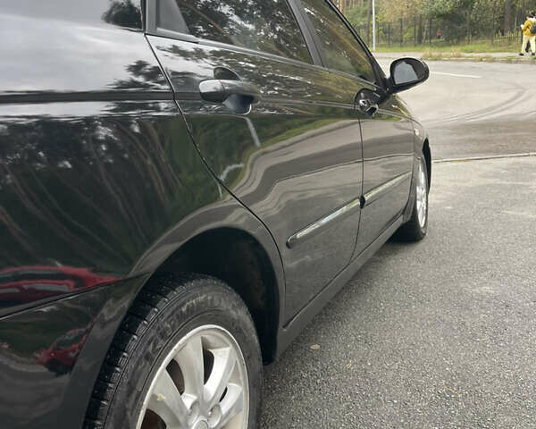 Черный Киа Черато, объемом двигателя 1.6 л и пробегом 211 тыс. км за 3200 $, фото 10 на Automoto.ua