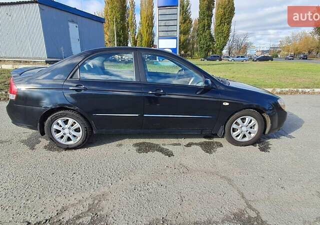 Черный Киа Черато, объемом двигателя 1.59 л и пробегом 349 тыс. км за 4000 $, фото 6 на Automoto.ua