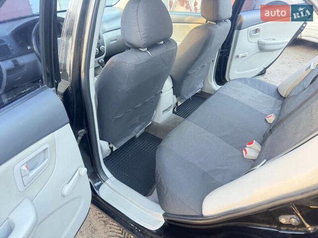 Чорний Кіа Черато, об'ємом двигуна 1.59 л та пробігом 250 тис. км за 4300 $, фото 11 на Automoto.ua