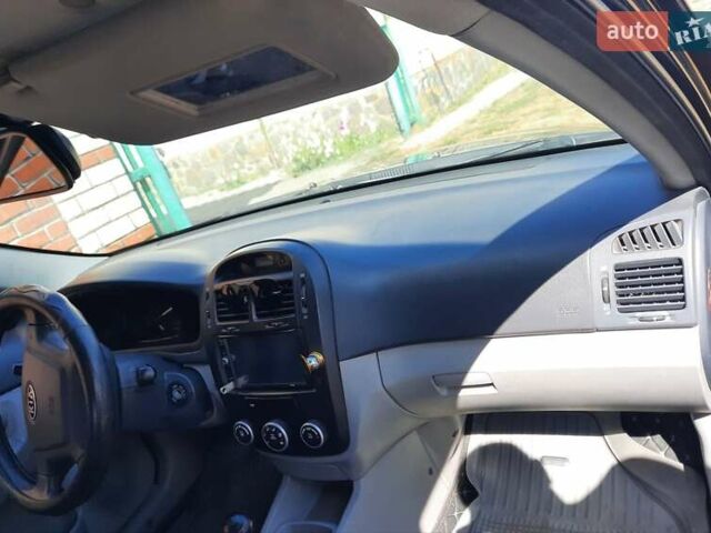 Черный Киа Черато, объемом двигателя 1.6 л и пробегом 277 тыс. км за 4200 $, фото 8 на Automoto.ua