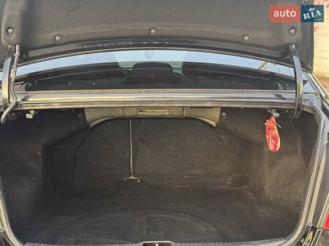 Черный Киа Черато, объемом двигателя 1.6 л и пробегом 235 тыс. км за 4900 $, фото 13 на Automoto.ua