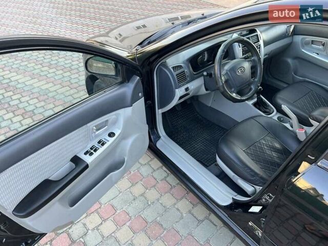 Черный Киа Черато, объемом двигателя 1.6 л и пробегом 208 тыс. км за 3900 $, фото 11 на Automoto.ua