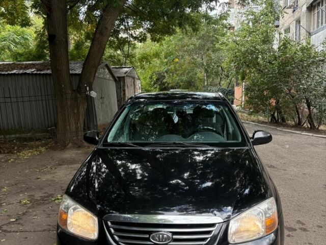 Черный Киа Черато, объемом двигателя 2 л и пробегом 250 тыс. км за 5000 $, фото 1 на Automoto.ua