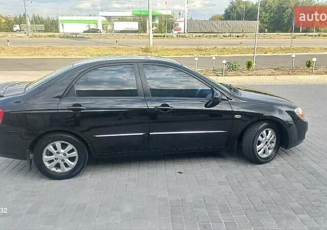 Черный Киа Черато, объемом двигателя 1.98 л и пробегом 268 тыс. км за 5200 $, фото 5 на Automoto.ua