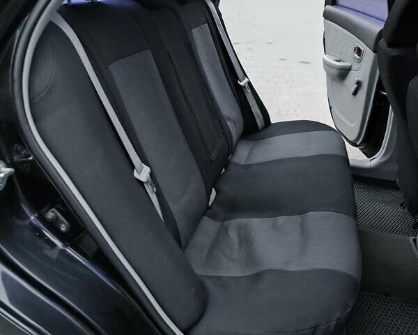 Чорний Кіа Черато, об'ємом двигуна 1.59 л та пробігом 300 тис. км за 4550 $, фото 24 на Automoto.ua